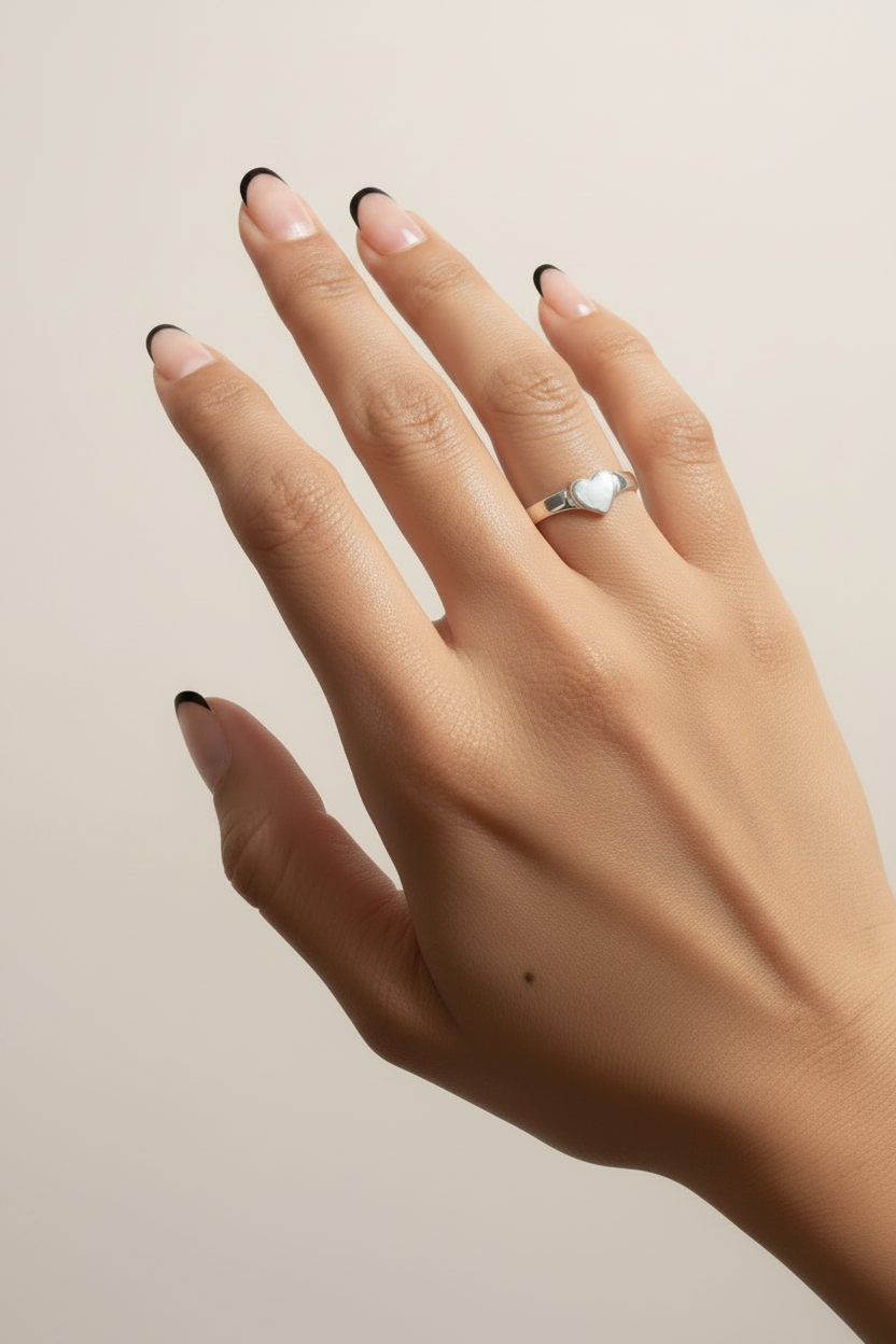 Black French Tip Manicure with Silver Heart Signet Ring