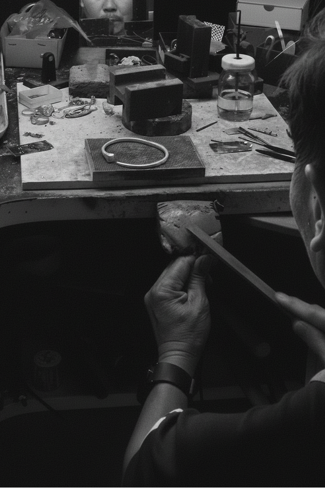 Father at the jewellery bench — B&W soft grain